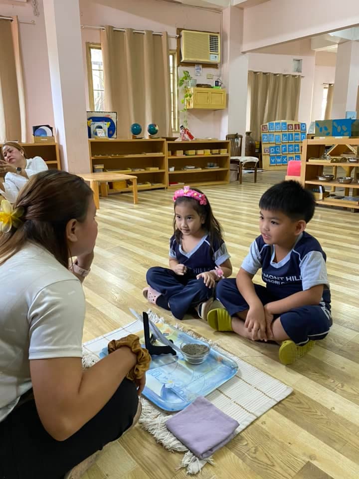 RHMC legacy photo: Facebook photo: chess and Montessori materials activity