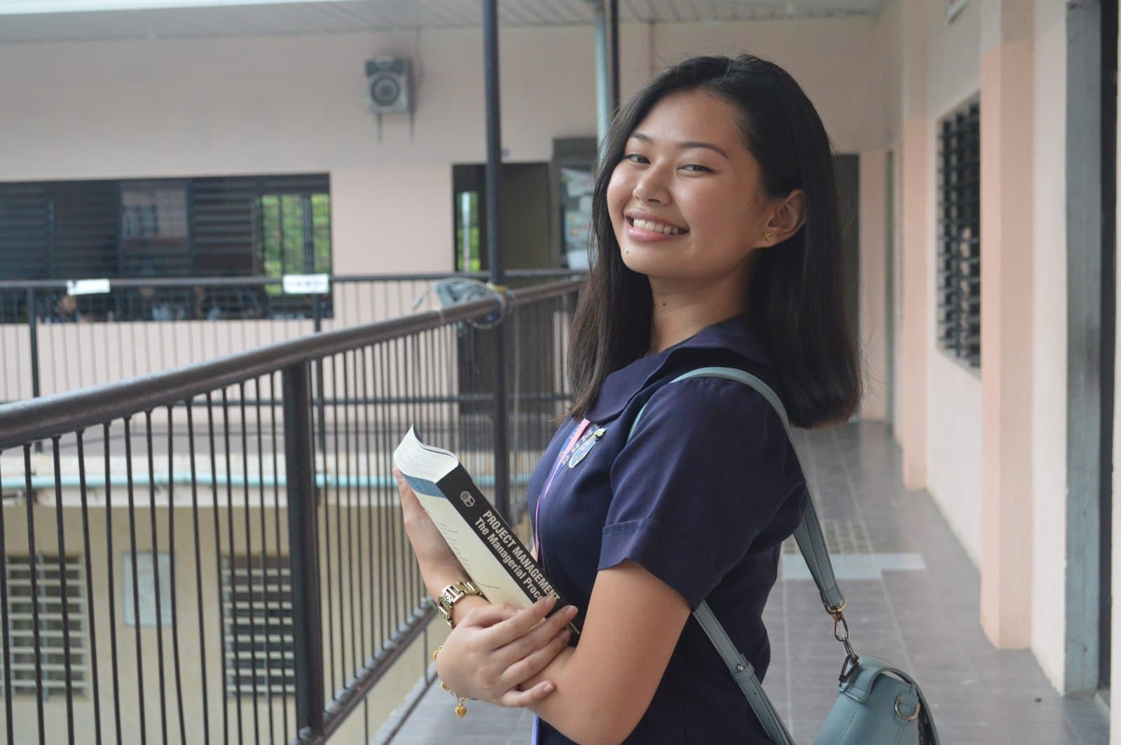 RHMC legacy photo: Student portrait on campus balcony