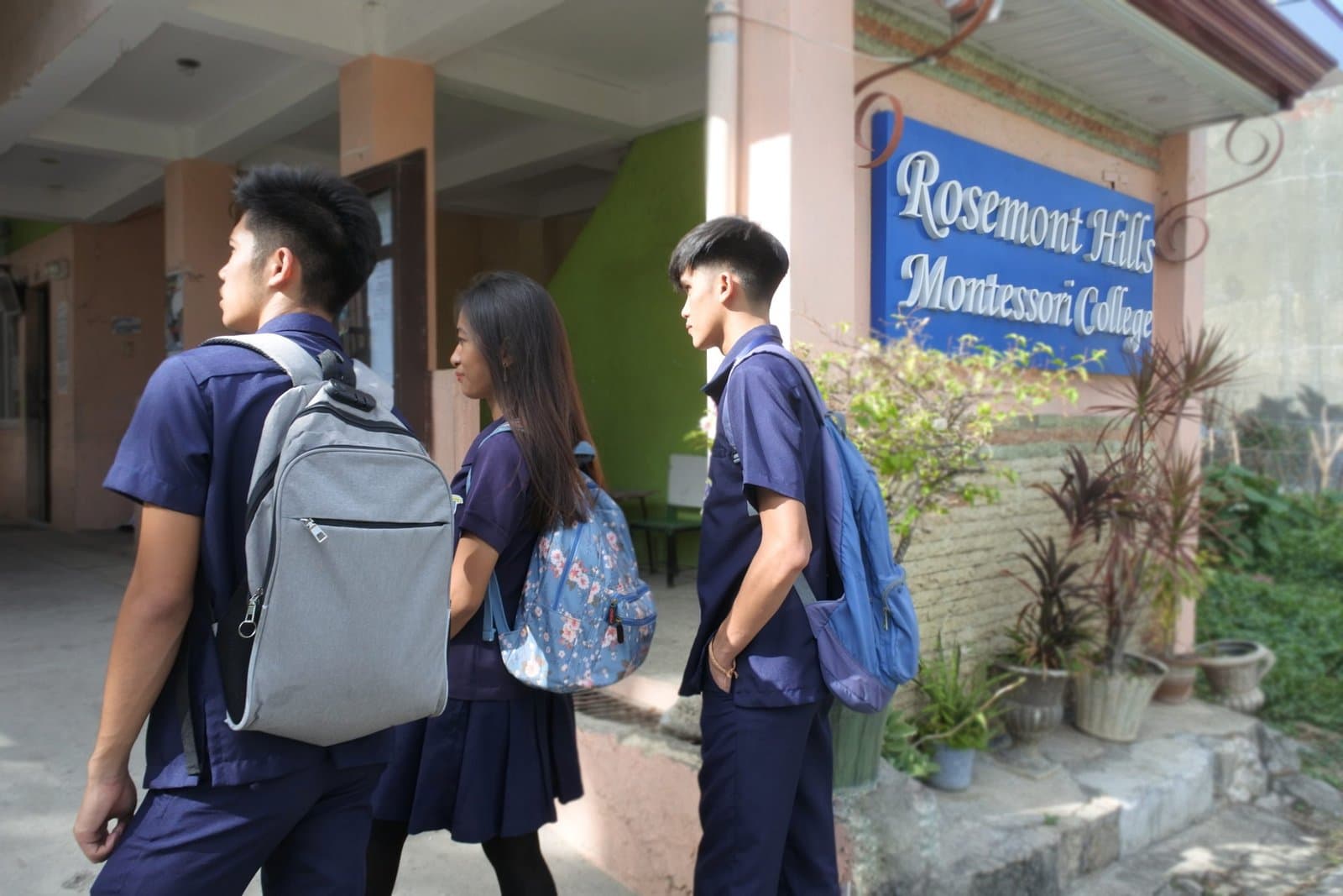 RHMC legacy photo: Students entering campus near signage